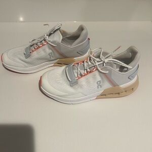 On Running womans White and Tan Athletic Shoes. Gently used. Good condition